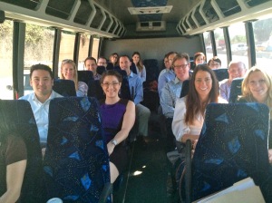 A photo of Jennifer sitting on the Justice Bus with other lawyers.